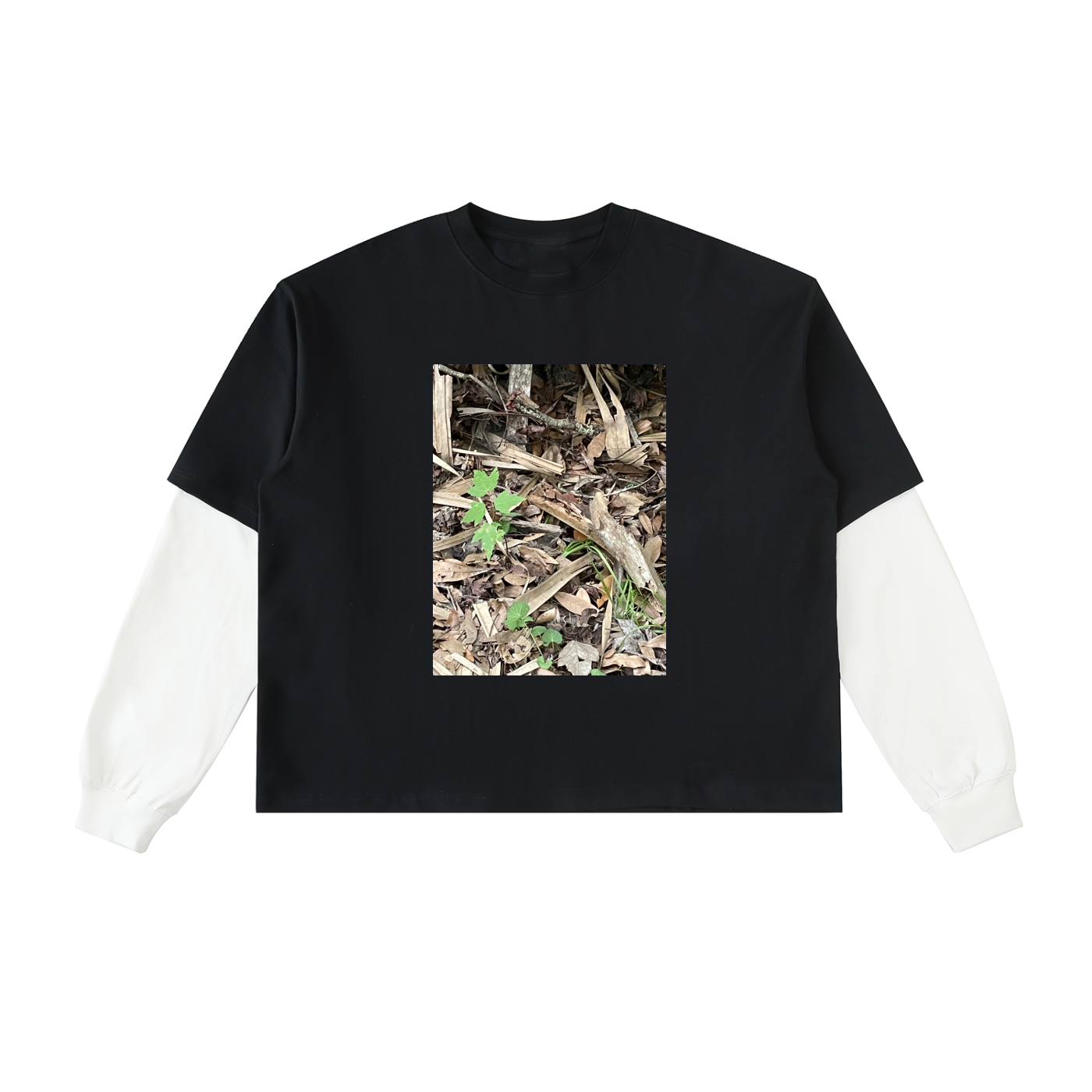 Black t-shirt with a white sleeve featuring a nature-themed graphic on a white background